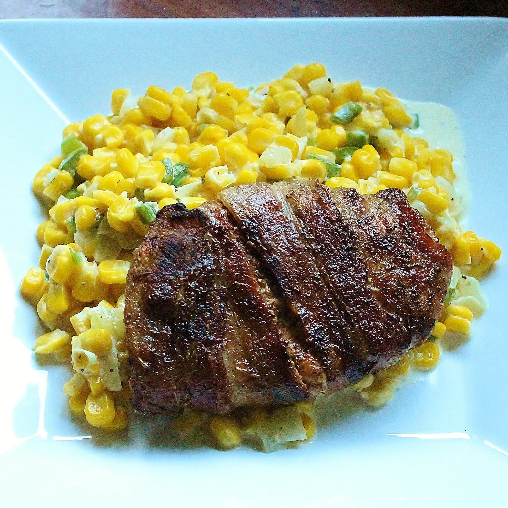 Bacon Wrapped Pork Chops with Jalapeno Cream Corn