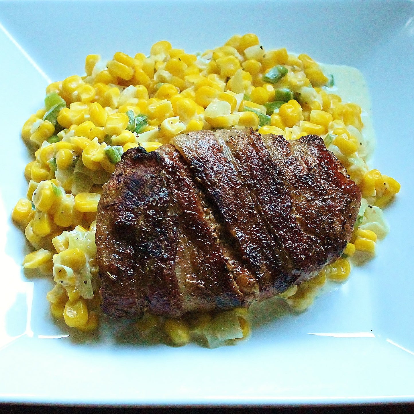 Bacon Wrapped Pork Chops with Jalapeno Cream Corn