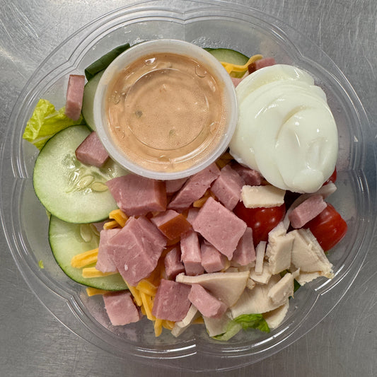 Chef Salad - greens topped with ham, turkey, cucumber, hard boiled egg, cheese, and tomatoes